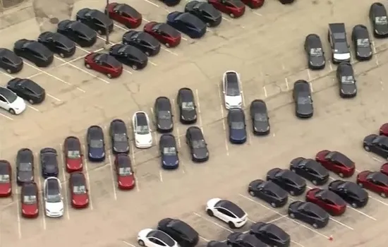 Tesla Cars Piled Up In A Parking Lot